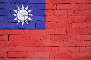 Taiwan flag is painted onto an old brick wall photo