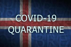 Iceland flag and Covid-19 quarantine inscription. Coronavirus or 2019-nCov virus photo