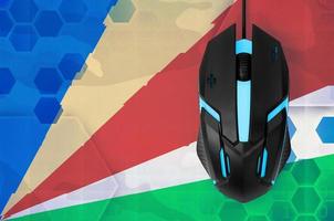 Seychelles flag and computer mouse. Concept of country representing e-sports team photo