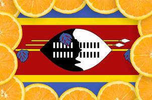 Swaziland flag in fresh citrus fruit slices frame photo