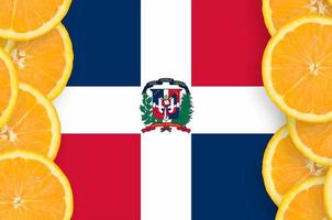 Dominican Republic flag in citrus fruit slices vertical frame photo