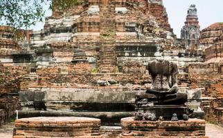 Old Buddha statues and pagodas of Wat Phra Ram, Ayutthaya, Thailand. It is an ancient site and tourist attraction. photo