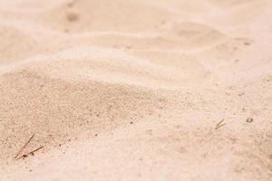 Yellow sand on a summer day, on the beach. Background. photo