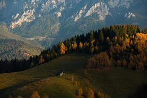 A charming mountain landscape in the Bucegi mountains, Carpathians, Romania. Autumn nature in Moeciu de Sus, Transylvania photo