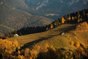 A charming mountain landscape in the Bucegi mountains, Carpathians, Romania. Autumn nature in Moeciu de Sus, Transylvania photo