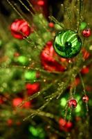 Colorful Spray of Green and Red Metallic Christmas Ornaments photo