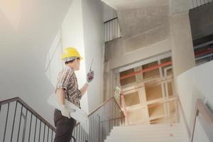 Construction engineering worker talking on radio,Construction engineer use radio communication at construction site. photo