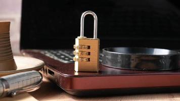 A code padlock on a laptop computer close up video