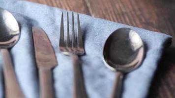 Close of of silverware utensils on a cloth napkin video