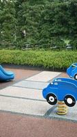 Outdoor play for children spring toy cars on sidewalk in vertical clip video