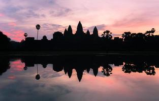 The silhouette of Angkor Wat before sunrise in Siem Reap province of Cambodia. photo