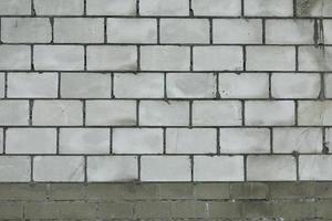 Wall of white blocks. Brick wall with cement seam. photo