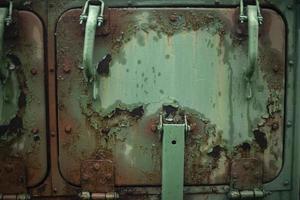 Rusty steel. Hatch door. Old military transport in detail. Rusty surface. photo