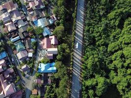 Neighborhood in green forest park aerial above top view. photo