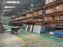 Modern warehouse storage interior retail store with pallet truck near the shelf photo