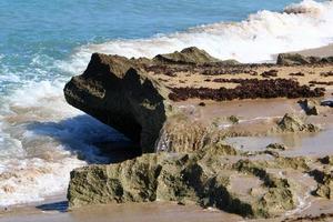 Rocks on the shores of the Mediterranean Sea in northern Israel. photo