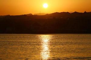 The Sun is the hottest star in our Galaxy around which the Earth revolves. photo
