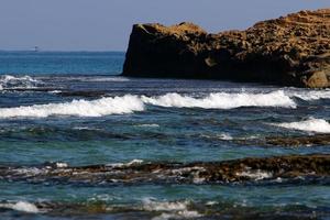 Rocks on the shores of the Mediterranean Sea in northern Israel. photo