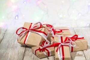 Christmas gift box against bokeh background. Holiday greeting card photo