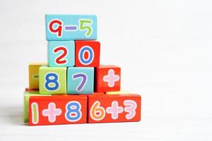 Number wood block cubes for learning Mathematic, education math concept. photo