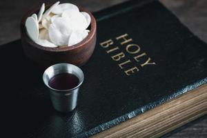 Concept of Eucharist or holy communion of Christianity. Eucharist is sacrament instituted by Jesus. during last supper with disciples. Bread and wine is body and blood of Jesus Christ of Christians. photo