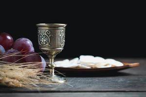 Concept of Eucharist or holy communion of Christianity. Eucharist is sacrament instituted by Jesus. during last supper with disciples. Bread and wine is body and blood of Jesus Christ of Christians. photo