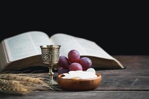 Concept of Eucharist or holy communion of Christianity. Eucharist is sacrament instituted by Jesus. during last supper with disciples. Bread and wine is body and blood of Jesus Christ of Christians. photo