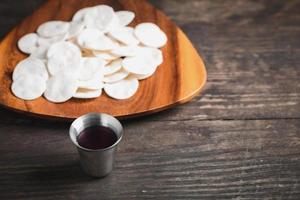 Concept of Eucharist or holy communion of Christianity. Eucharist is sacrament instituted by Jesus. during last supper with disciples. Bread and wine is body and blood of Jesus Christ of Christians. photo