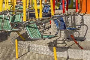 Empty swings on children playground. Close photo