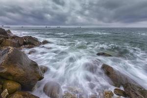 Cloudy, cold day. Stunning long exposure day seascape. photo