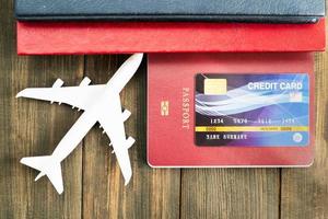 Credit card put on passport on wooden table photo