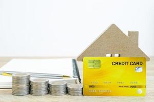House model and credit card on table photo