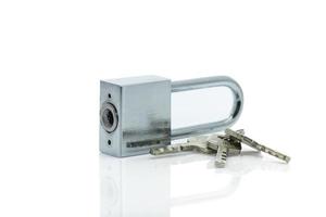 Padlock with three keys on white background photo