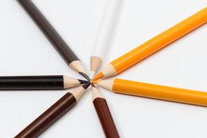 Multi color pencils. the concept of a multinational family and equality in the world. photo