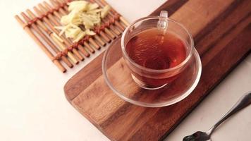 Top view of ginger tea on wooden background video