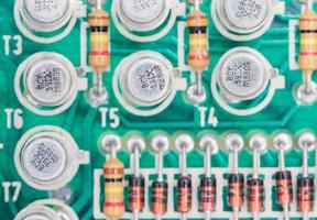 Condensers and Resistor assembly on the circuit board photo