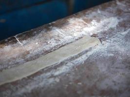 Preparation of flour for making Pa Tong Go or Chinese Traditional Snacks Deep Fried Dough Stick. Concept popular THAI breakfast photo