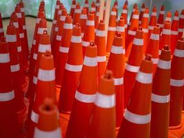 A row of traffic cones background . Concept  traffic photo