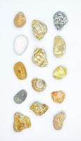 Composition with seashells and natural stones on white background. Flat lay travel concept. photo