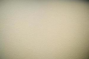 pared de estuco decorativo de construcción en relieve de color beige. textura, fondo foto