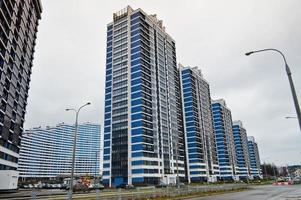 New modern tall blue glass multi-storey comfortable urban monolithic frame houses buildings skyscrapers new buildings in the big city of the megalopolis photo