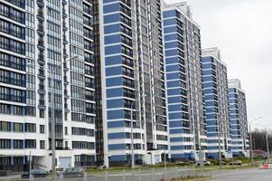 New modern tall blue glass multi-storey comfortable urban monolithic frame houses buildings skyscrapers new buildings in the big city of the megalopolis photo