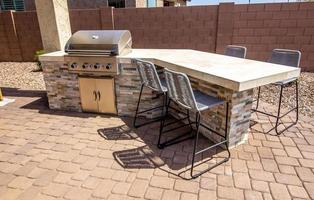 Outside BBQ Station With Four Bar Stools photo