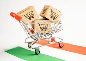 Box with shopping cart logo and Hungary flag, Import Export Shopping online or eCommerce finance delivery service store product shipping, trade, supplier concept. photo