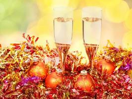 glasses, gold Xmass balls on blurry background 3 photo