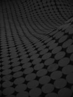 An undulating surface with a pattern of gray circles on a black texture photo