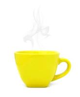 Yellow cup with hot drink on white background photo