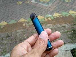 This navy colored electric cigarette is very simple and easy to hold photo