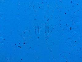 Depressions in the form of a stop button. Azure wall. Put your text here photo