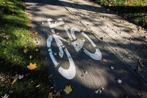 Symbol of bike path in the autumn park. photo